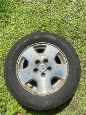 P205 General Tire P205/65 Used 15 Inch 5-lug Steal Deal With Rim